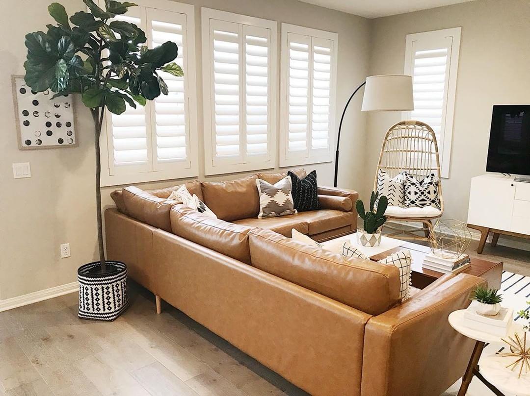 Warm living room with Polywood shutters in Hartford.